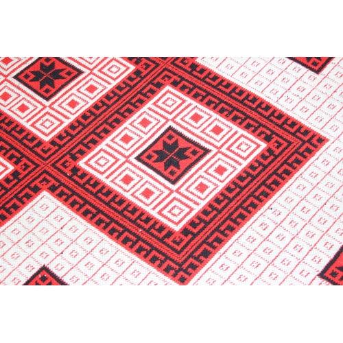 201 - A vintage Welsh style reversible blanket of red, black and white, approx. 215cm x 240cm