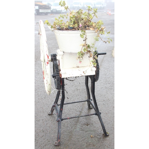 302 - A vintage cast iron Bentall grinder or mangle base with later added planter, white and black painted... 