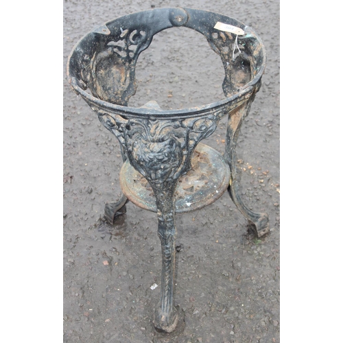 304 - A vintage cast iron pub table base, approx 46cm wide x 68cm tall