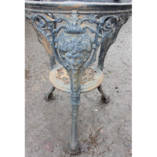 304 - A vintage cast iron pub table base, approx 46cm wide x 68cm tall