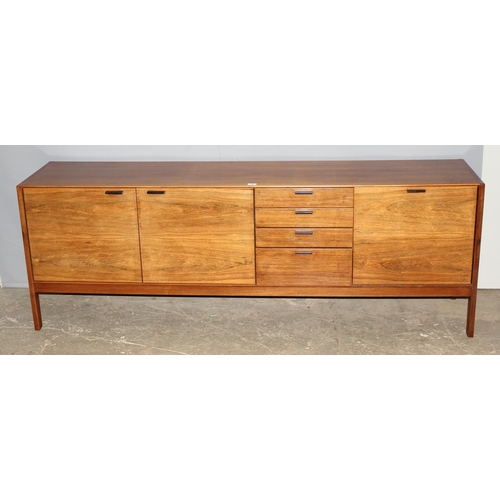 8 - A retro mid-century Meredew sideboard, a bank of 4 drawers flanked by 3 cupboards, approx 206cm wide... 