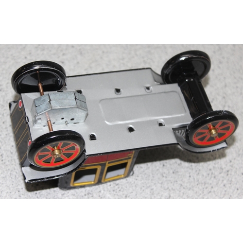 1543 - Ichimura Co Japanese vintage tinplate friction propelled model T Ford in original box and a Japanese... 