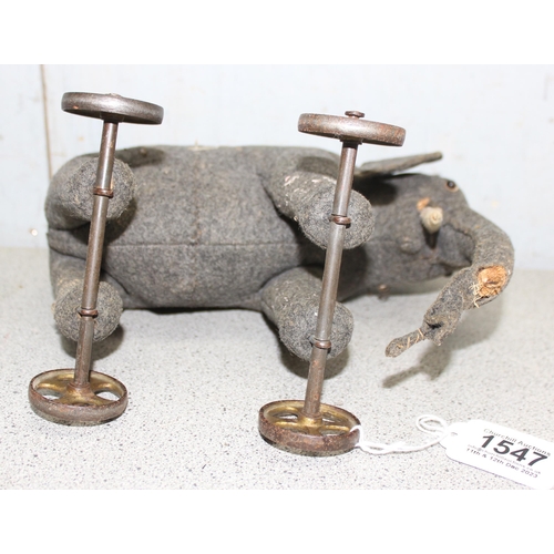 1547 - A well-loved vintage Steiff grey elephant on wheels, approx 25cm long