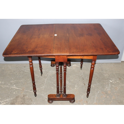 160 - An antique mahogany dropleaf table on turned legs, approx 113cm wide x 84cm deep x 73cm tall