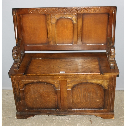 164 - A vintage carved oak Monk's bench or storage box with lion supports, approx 96cm wide x 42cm deep x ... 