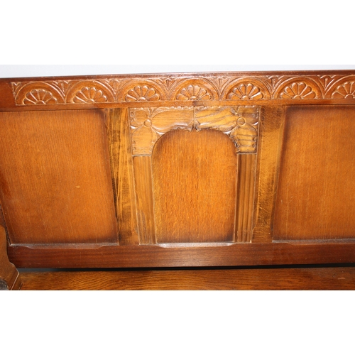 164 - A vintage carved oak Monk's bench or storage box with lion supports, approx 96cm wide x 42cm deep x ... 