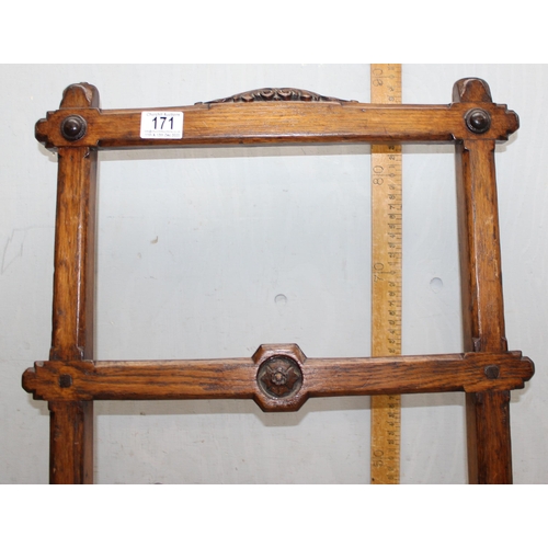 171 - 19c oak Pugin inspired cross framed chair with central turned stretcher and carvings to back rest ra... 