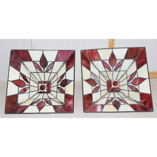 253 - A pair of red and cream Tiffany style glass ceiling shades with chain fixings, approx 32cm x 32cm