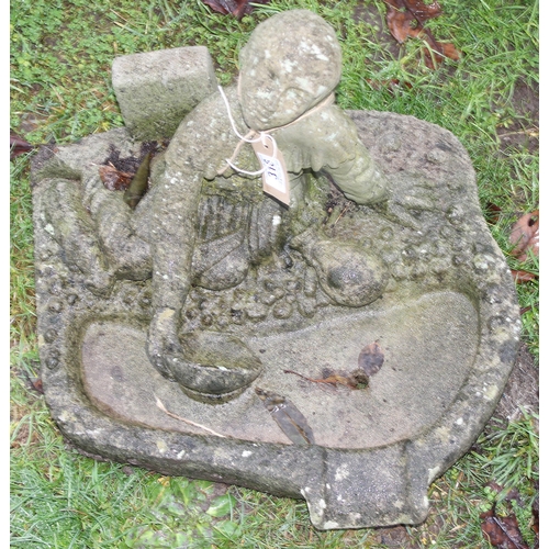 316 - A weathered concrete birdbath formed as a seated male, approx 48cm wide