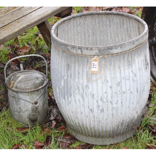 317 - A vintage galvanized wash tub and a galvanised watering can, the tub approx 47cm wide x 56cm tall