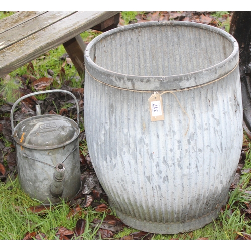 317 - A vintage galvanized wash tub and a galvanised watering can, the tub approx 47cm wide x 56cm tall