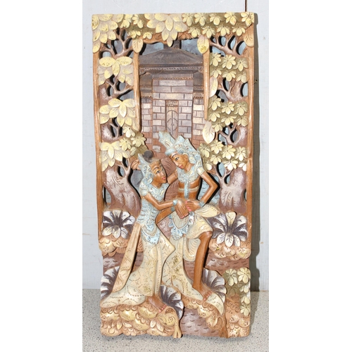 491 - A vintage Chinese carved wooden panel and a larger polychrome Indian panel with fine carved detail a... 