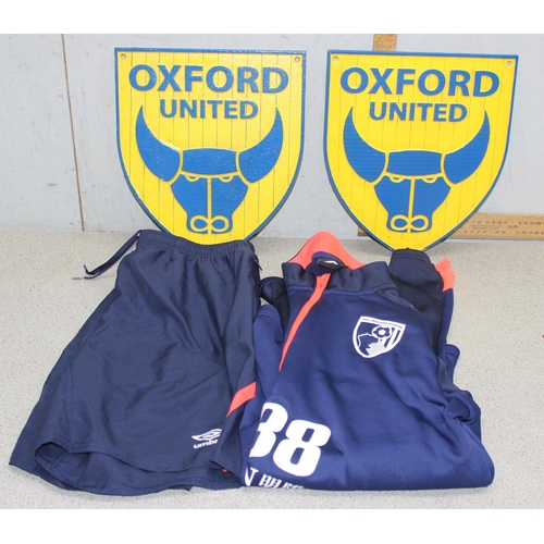 717 - Two large cast metal Oxford United wall plaques in team colours, approx 26cm x 30cm & AFC Bournemout... 