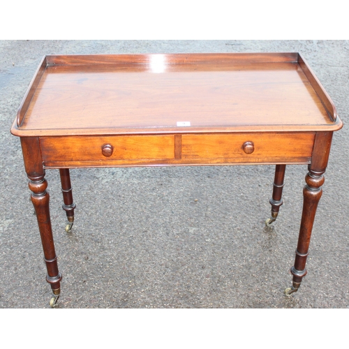 9 - A 19th century Howard & Sons 2 drawer mahogany side table the drawers stamped Howard & Sons Berners ... 