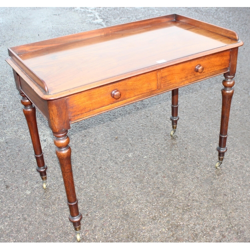 9 - A 19th century Howard & Sons 2 drawer mahogany side table the drawers stamped Howard & Sons Berners ... 