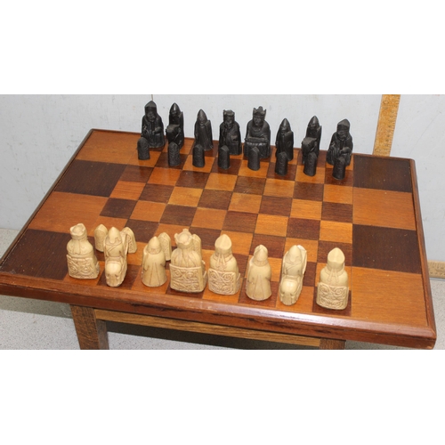 1545 - A vintage Isle of Lewis designed chess set with wooden chess table