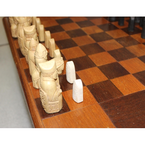 1545 - A vintage Isle of Lewis designed chess set with wooden chess table