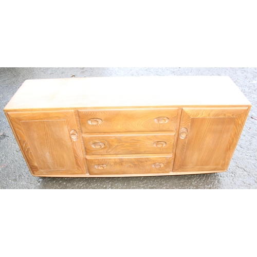 10 - A retro Ercol Windsor range blonde finish sideboard, 3 central drawers flanked by 2 cupboards, appro... 