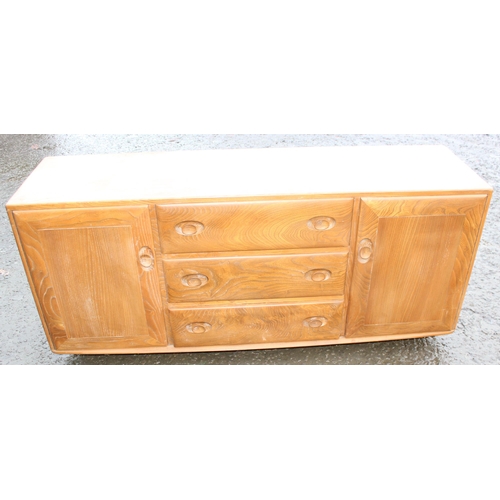 10 - A retro Ercol Windsor range blonde finish sideboard, 3 central drawers flanked by 2 cupboards, appro... 