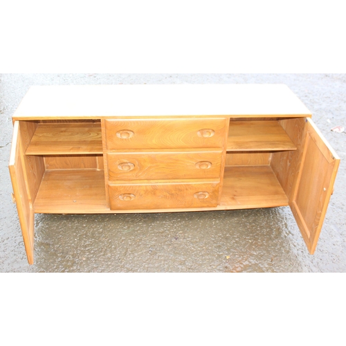 10 - A retro Ercol Windsor range blonde finish sideboard, 3 central drawers flanked by 2 cupboards, appro... 