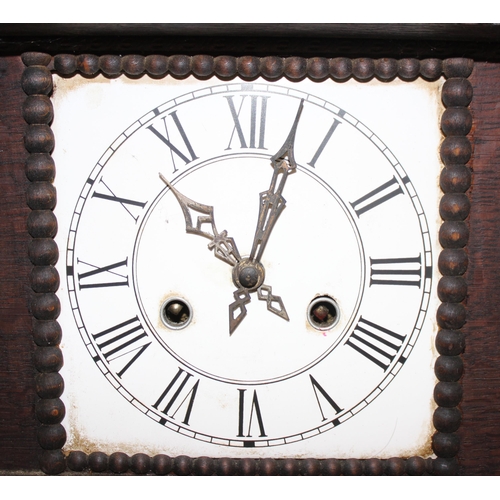 1338 - An unusual antique oak table top collectors cabinet with mechanical clock approx. 35cm tall