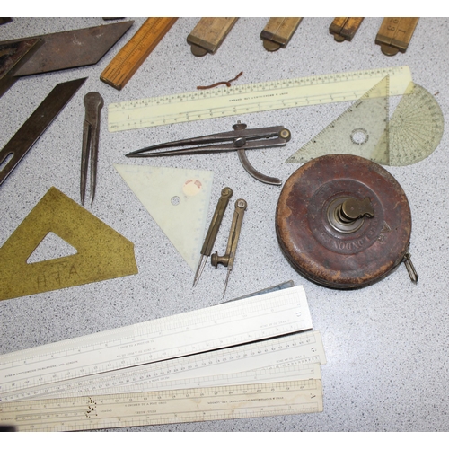 671 - Qty of vintage measuring equipment to include set squares, rulers and tape measures