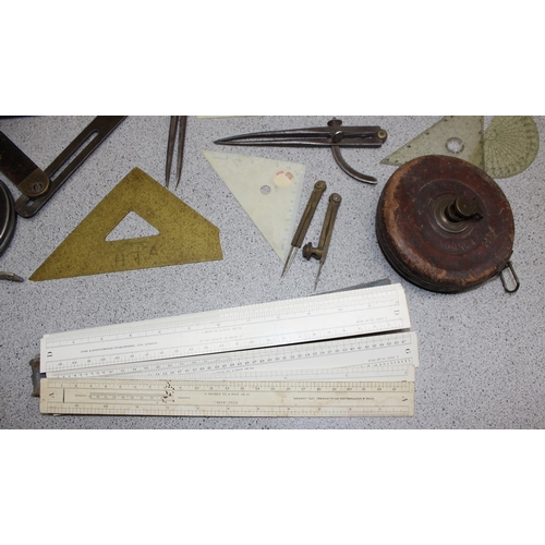 671 - Qty of vintage measuring equipment to include set squares, rulers and tape measures