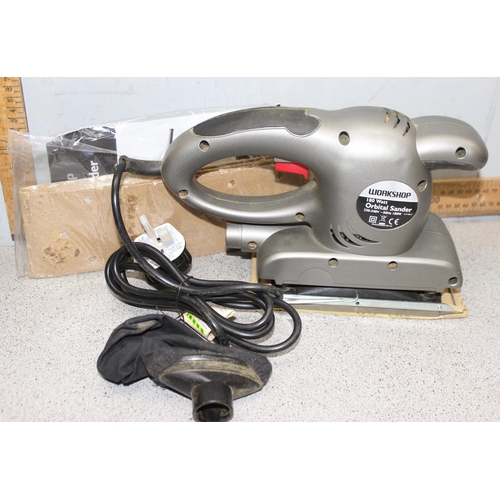 823 - 3 power tools to include a C.K compound mitre saw, diamond wheel tile cutter and an orbital sander