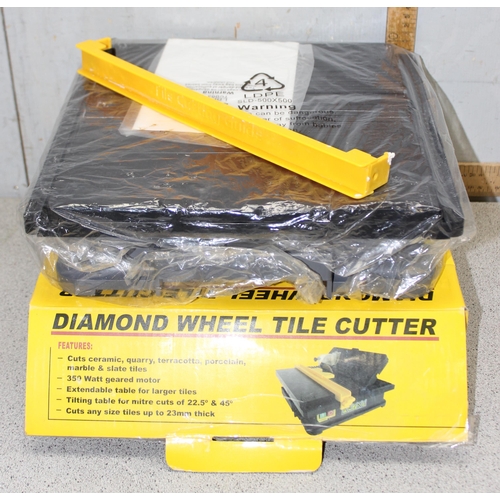 823 - 3 power tools to include a C.K compound mitre saw, diamond wheel tile cutter and an orbital sander