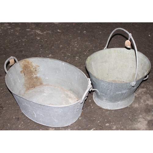 322 - A vintage galvanised bucket and a galvanised 2 handled bucket or tub, the tub approx 62cm wide