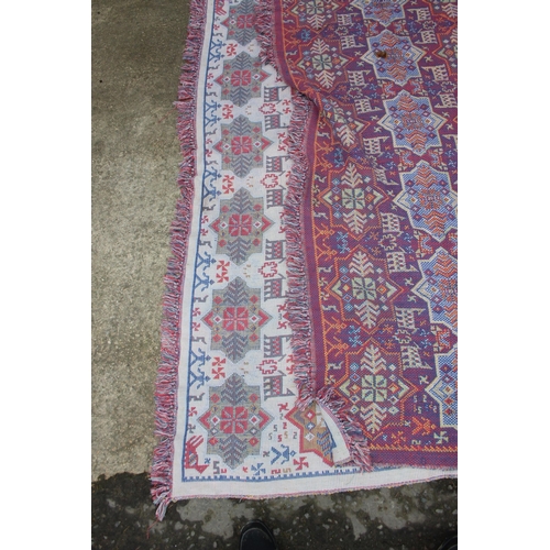 220 - A decorative Welsh blanket style reversible throw or blanket of cream and pink ground, approx 195cm ... 