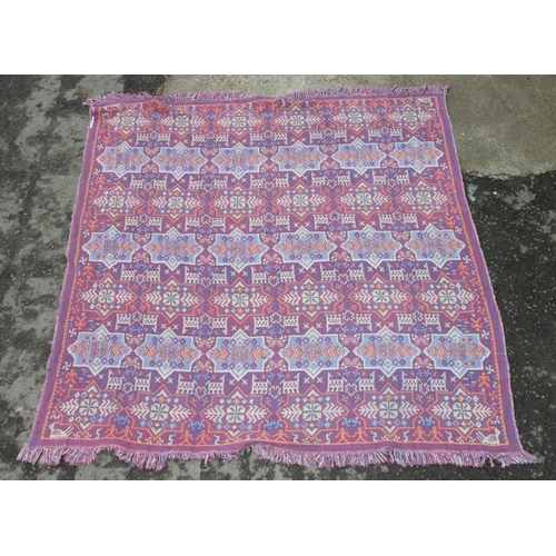 220 - A decorative Welsh blanket style reversible throw or blanket of cream and pink ground, approx 195cm ... 