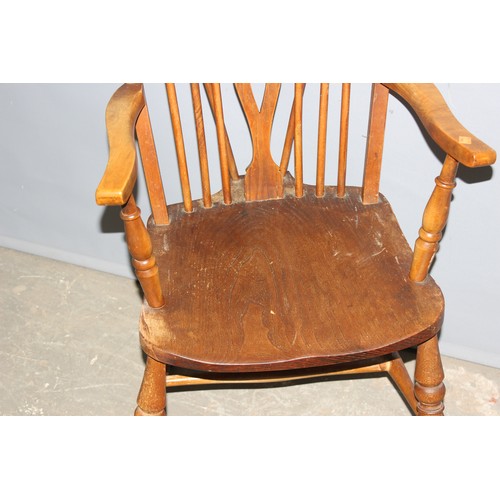 31 - A vintage wheel back kitchen armchair