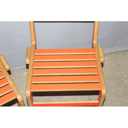 35 - A pair of unusual retro red painted bent plywood chairs