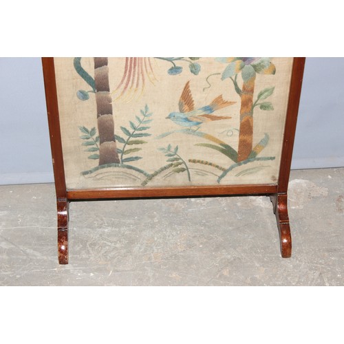 36 - An early 20th century oak framed fire screen with Art Nouveau style embroidered panel, approx 55cm w... 