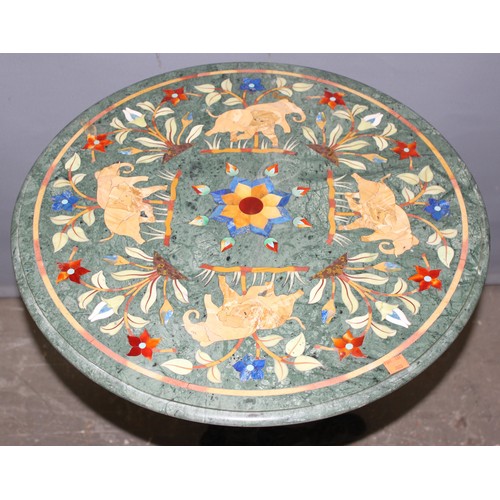 97 - A high decorative marble topped table with cast iron base, the marble top with Pietra Dura inlay lik... 