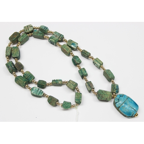 1140 - An unusual turquoise glazed ceramic scarab beetle formed as a pendant on chain formed from other sma... 