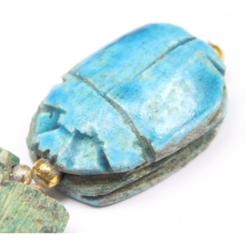 1140 - An unusual turquoise glazed ceramic scarab beetle formed as a pendant on chain formed from other sma... 