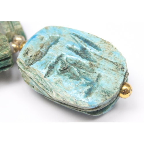 1140 - An unusual turquoise glazed ceramic scarab beetle formed as a pendant on chain formed from other sma... 