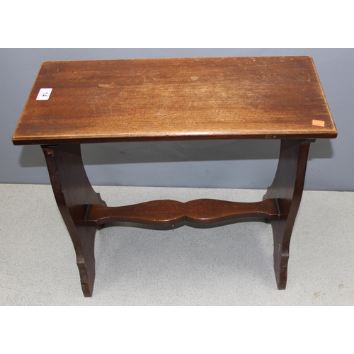 14 - An antique mahogany piano stool with decorative stretcher, approx 62cm wide