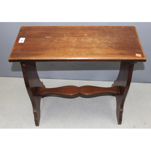 14 - An antique mahogany piano stool with decorative stretcher, approx 62cm wide