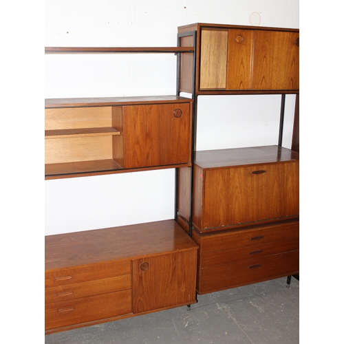 98 - A retro mid-century Avalon modular wall unit, 5 various cupboards and shelf, approx 249cm wide x 44c... 