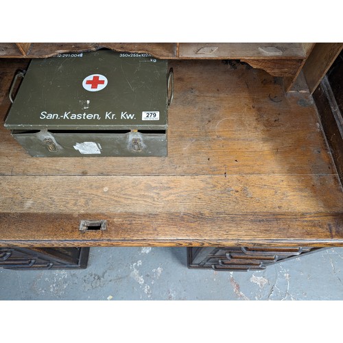 18 - An antique oak roll top desk with tambour front, approx 127cm wide x 76cm deep x 126cm tall