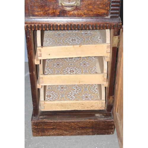 110 - An unusual early 20th century Art Nouveau/ Art Deco crossover period oak desk with brass handles, ap... 
