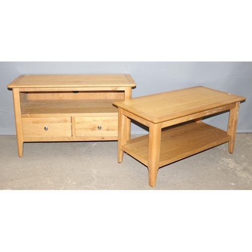 107 - A modern light oak coffee table and a similar matching TV stand which is approx 90cm wide x 40cm dee... 