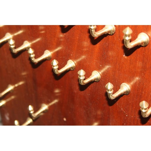 277 - A pair of stained hardwood and brass hook mounted key hanging panels, 20th century, each approx 94cm... 