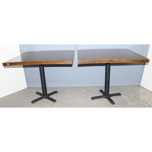 99 - A pair of metal base and square topped café or restaurant tables, each approx 90cm square x 73cm tal... 