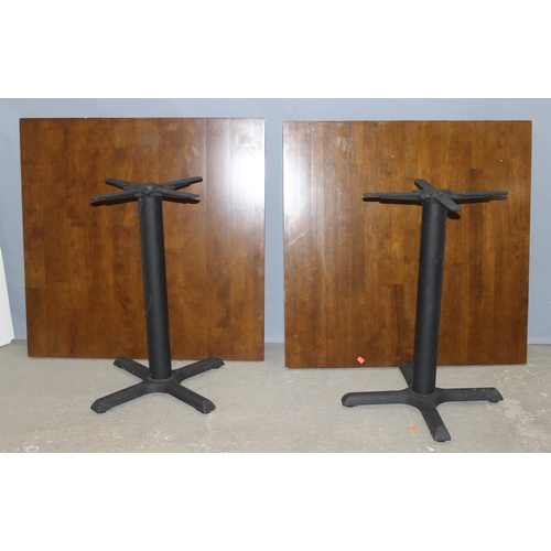 99 - A pair of metal base and square topped café or restaurant tables, each approx 90cm square x 73cm tal... 
