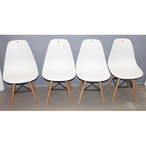 25 - A set of 4 Eames DSW style chairs, white seat with wooden bases