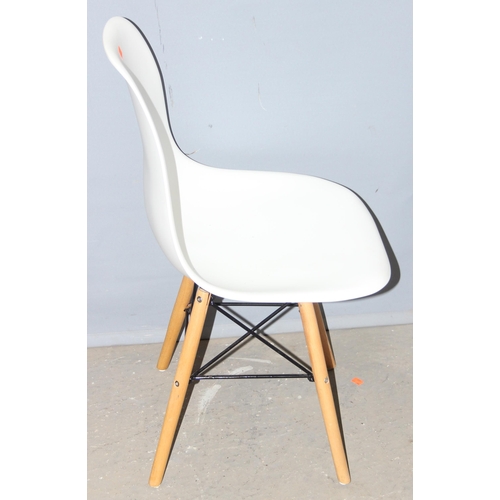25 - A set of 4 Eames DSW style chairs, white seat with wooden bases